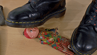 78970 - Antique toys and boxes under Doc Martens