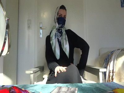 163844 - Trying on different scarfs masks with headscarves