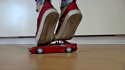 105400 - Red car under red sneakers