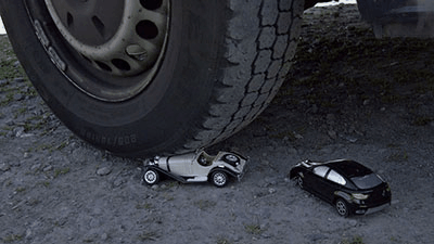 129201 - 2 little cars under my giant tires (small version)