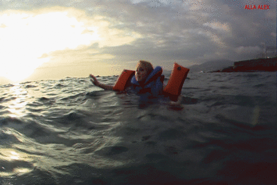185553 - Alla swims in the sea and wears an inflatable Snorke Pro vest and inflatable Snorke Pro armbands!