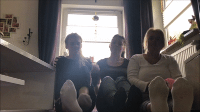 125122 - Mother and two daughters show off their socks and barefeet to you losers.
