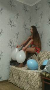148209 - Girl treading barefoot in balloons