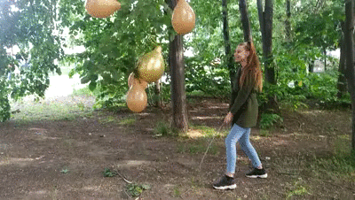 148229 - Girl with a stick explodes balloons