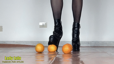 160398 - Oranges under the black high-heeled booties