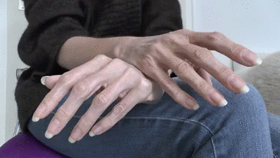 201303 - Long natural fingernails close-up on jeans legs