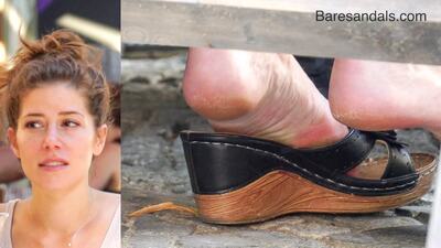 190994 - Platform wooden sandals on the feet of a blonde sitting outside - Video update 13234