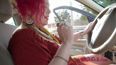 94918 - Eden smokes 2 cigarettes, pedal pumps, and revs in her car (long)