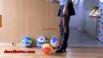 Girl in boots popping ballons (0064)